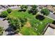 Aerial view of community park surrounded by manicured landscaping and features picnic tables and mature trees at 18811 N 34Th Ave # 6, Phoenix, AZ 85027