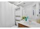 This bathroom has white fixtures and ample built-in storage at 18811 N 34Th Ave # 6, Phoenix, AZ 85027