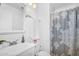 This bathroom has white fixtures and a decorative shower curtain at 18811 N 34Th Ave # 6, Phoenix, AZ 85027