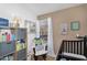 This bright Bedroom has a comfortable chair with a quilted blanket, books, and decor at 18811 N 34Th Ave # 6, Phoenix, AZ 85027