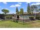 Inviting community pool with wrought iron fence and mature trees for shade at 18811 N 34Th Ave # 6, Phoenix, AZ 85027
