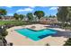Community pool with seating, landscaping and nearby residential area for relaxation at 18811 N 34Th Ave # 6, Phoenix, AZ 85027