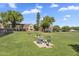 Enjoy the outdoors at the picnic tables in the community green space with beautiful trees and buildings at 18811 N 34Th Ave # 6, Phoenix, AZ 85027