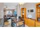 A dining room with a dark wood table sits adjacent to the living area at 18811 N 34Th Ave # 6, Phoenix, AZ 85027