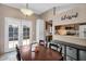 A dining room area features a kitchen view, and access to outdoor patio at 18811 N 34Th Ave # 6, Phoenix, AZ 85027