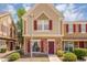 Charming multi-level home featuring brick accents, red shutters and a welcoming walkway leading to the front door at 18811 N 34Th Ave # 6, Phoenix, AZ 85027