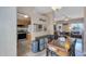 A kitchen overlooks the dining and living area in this open concept layout at 18811 N 34Th Ave # 6, Phoenix, AZ 85027