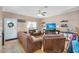 Bright living room with hard wood floors, modern shelving, and large windows for ample natural light at 18811 N 34Th Ave # 6, Phoenix, AZ 85027