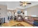 Open-concept living room flowing into dining area, featuring neutral tones, wood floors, and comfortable seating at 18811 N 34Th Ave # 6, Phoenix, AZ 85027