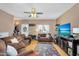 Comfortable living room featuring hardwood floors, ceiling fan, and natural light with stylish decor at 18811 N 34Th Ave # 6, Phoenix, AZ 85027