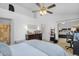 This spacious main bedroom is bright with white walls, ceiling fan, vaulted ceiling, and access to a walk-in closet at 18811 N 34Th Ave # 6, Phoenix, AZ 85027