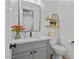 Stylish bathroom features a modern vanity, sleek mirror, and fresh decor, creating a serene atmosphere at 18826 E Augusta Ave, Queen Creek, AZ 85142