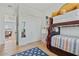 Bedroom with bunk beds, closet, and view of the living area at 18826 E Augusta Ave, Queen Creek, AZ 85142