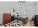 Bedroom features a queen bed, area rug, and shuttered window at 18826 E Augusta Ave, Queen Creek, AZ 85142
