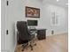 Home office with a black desk and chair offers a functional space for work or study at 18826 E Augusta Ave, Queen Creek, AZ 85142
