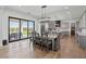 Open dining area and kitchen with backyard access through sliding glass doors at 18826 E Augusta Ave, Queen Creek, AZ 85142