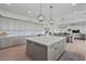 Spacious kitchen features a large island with pendant lights and stainless appliances at 18826 E Augusta Ave, Queen Creek, AZ 85142