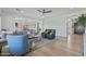 Open concept living room boasts light wood floors and comfortable seating at 18826 E Augusta Ave, Queen Creek, AZ 85142