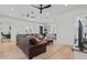 Comfortable living room with plush seating and stylish decor, open to the modern kitchen at 18826 E Augusta Ave, Queen Creek, AZ 85142