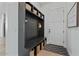 Convenient mudroom with a bench, storage, and hooks for organizing coats and bags near the entrance at 18826 E Augusta Ave, Queen Creek, AZ 85142