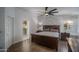 Primary bedroom featuring ensuite bathroom, accent wall and plenty of natural light at 19115 N 71St Dr, Glendale, AZ 85308