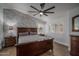 Well-lit bedroom features a large bed, bedside tables, and shuttered windows at 19115 N 71St Dr, Glendale, AZ 85308