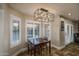 Cozy dining area with modern light fixture and shuttered windows at 19115 N 71St Dr, Glendale, AZ 85308