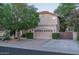This well-maintained, two-story single-Gathering home features a three-car garage and mature landscaping at 19115 N 71St Dr, Glendale, AZ 85308
