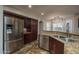 Well-equipped kitchen with stainless steel appliances, granite countertops, and ample storage at 19115 N 71St Dr, Glendale, AZ 85308