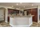 Modern kitchen with granite countertops, stainless steel appliances, and custom cabinetry at 19115 N 71St Dr, Glendale, AZ 85308