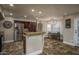 Bright kitchen with stainless steel appliances, granite countertops, and a breakfast bar at 19115 N 71St Dr, Glendale, AZ 85308