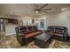 Open-concept living room seamlessly connects to the dining and kitchen area at 19115 N 71St Dr, Glendale, AZ 85308