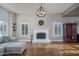 Spacious living room featuring a fireplace, hardwood floors, and ample natural light at 19115 N 71St Dr, Glendale, AZ 85308