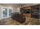 Comfortable living room with a leather recliner sofa and built-in entertainment center at 19115 N 71St Dr, Glendale, AZ 85308