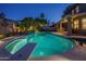 Backyard pool with diving board, hot tub, and covered patio, perfect for entertaining or relaxing with Gathering and friends at 19115 N 71St Dr, Glendale, AZ 85308