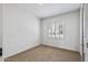 Cozy bedroom showcasing a neutral color palette and natural light at 19225 N Tallowood Way, Surprise, AZ 85387