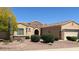 Charming single-story home with well-maintained landscaping and a desert-style front yard with stone accents at 19225 N Tallowood Way, Surprise, AZ 85387