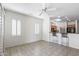 Eat-in Kitchen and bonus room with tile floors, bar stool seating and lots of natural light at 19225 N Tallowood Way, Surprise, AZ 85387