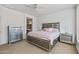 Serene bedroom featuring a ceiling fan and ensuite bathroom at 19225 N Tallowood Way, Surprise, AZ 85387