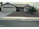 Charming single-story home with a desert landscape and a neutral-toned exterior at 20298 N 108Th Ln, Sun City, AZ 85373