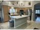 Bright kitchen features a center island, stainless steel appliances and lots of natural light at 20298 N 108Th Ln, Sun City, AZ 85373
