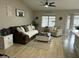 Cozy living room with plush sofa, decorative pillows, and a charming decor at 20298 N 108Th Ln, Sun City, AZ 85373