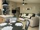 Open-concept space with kitchen island flowing into a cozy living room at 20298 N 108Th Ln, Sun City, AZ 85373