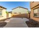 Enclosed backyard with block fencing, desert landscaping, gravel and concrete patio space at 20423 W Springfield St, Buckeye, AZ 85396
