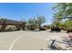 Neighborhood basketball court featuring covered picnic areas, lush desert landscaping, and playground at 20423 W Springfield St, Buckeye, AZ 85396