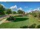 Well-manicured community green space with lush lawn and landscaping, offering a serene environment at 20423 W Springfield St, Buckeye, AZ 85396