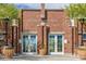 Beautiful brick building, Heritage Swim Park, with decorative planters at the entrance at 20423 W Springfield St, Buckeye, AZ 85396