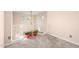 A carpeted loft area with white railings and potted plants, bathed in natural light from nearby windows at 20423 W Springfield St, Buckeye, AZ 85396