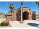 Red brick building marking the entrance to Redmond Field with beautiful desert landscaping at 20423 W Springfield St, Buckeye, AZ 85396