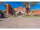 Stunning clubhouse exterior with a grand entrance, lush landscaping, and ample parking at 20581 N Enchantment Pass, Maricopa, AZ 85138